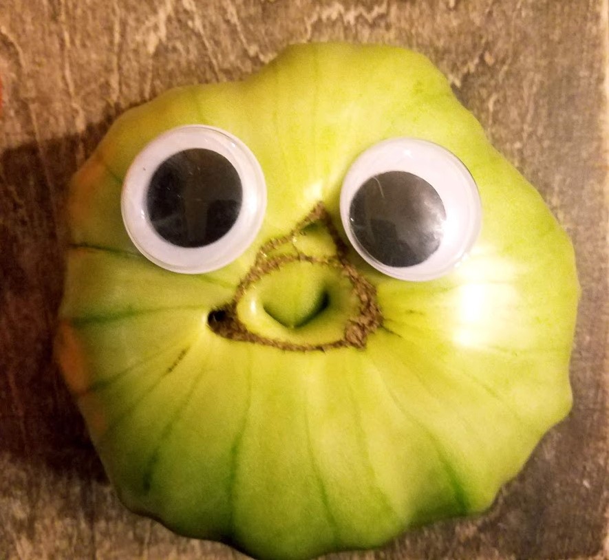 Wiggly eyed happy Green tomato