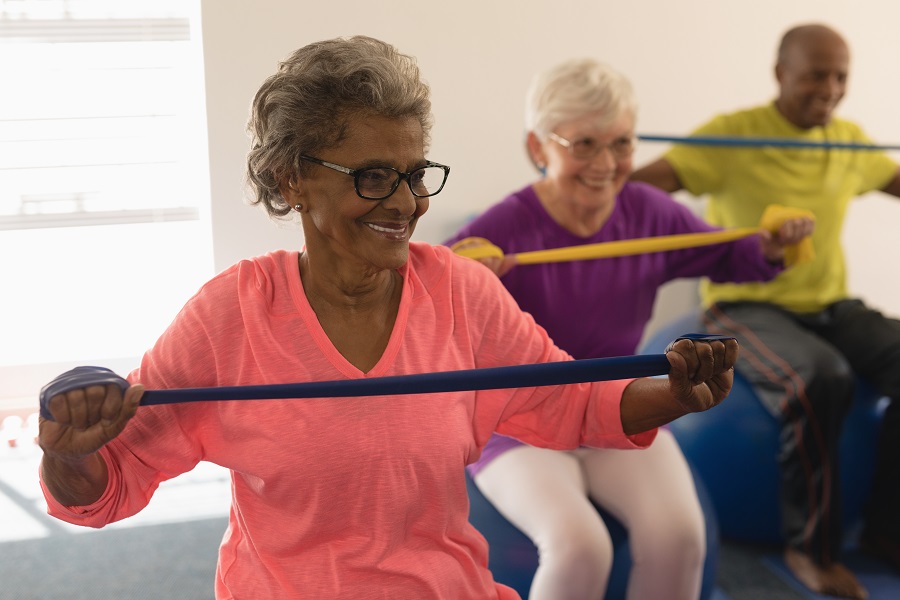 How to teach partner resistance band exercises for older adults and seniors  group fitness classes 